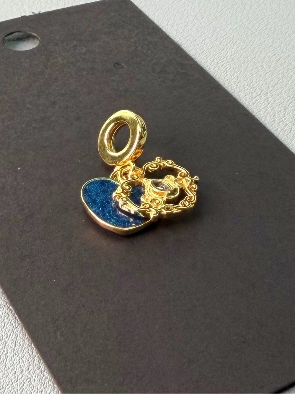 Gold Charm Pendant with Blue Heart and Filigree Accent